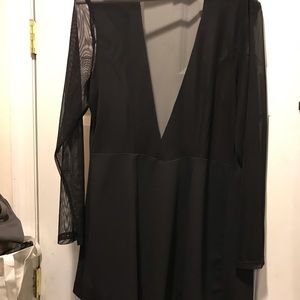 Black blazer. Sheer sleeves and sheer back